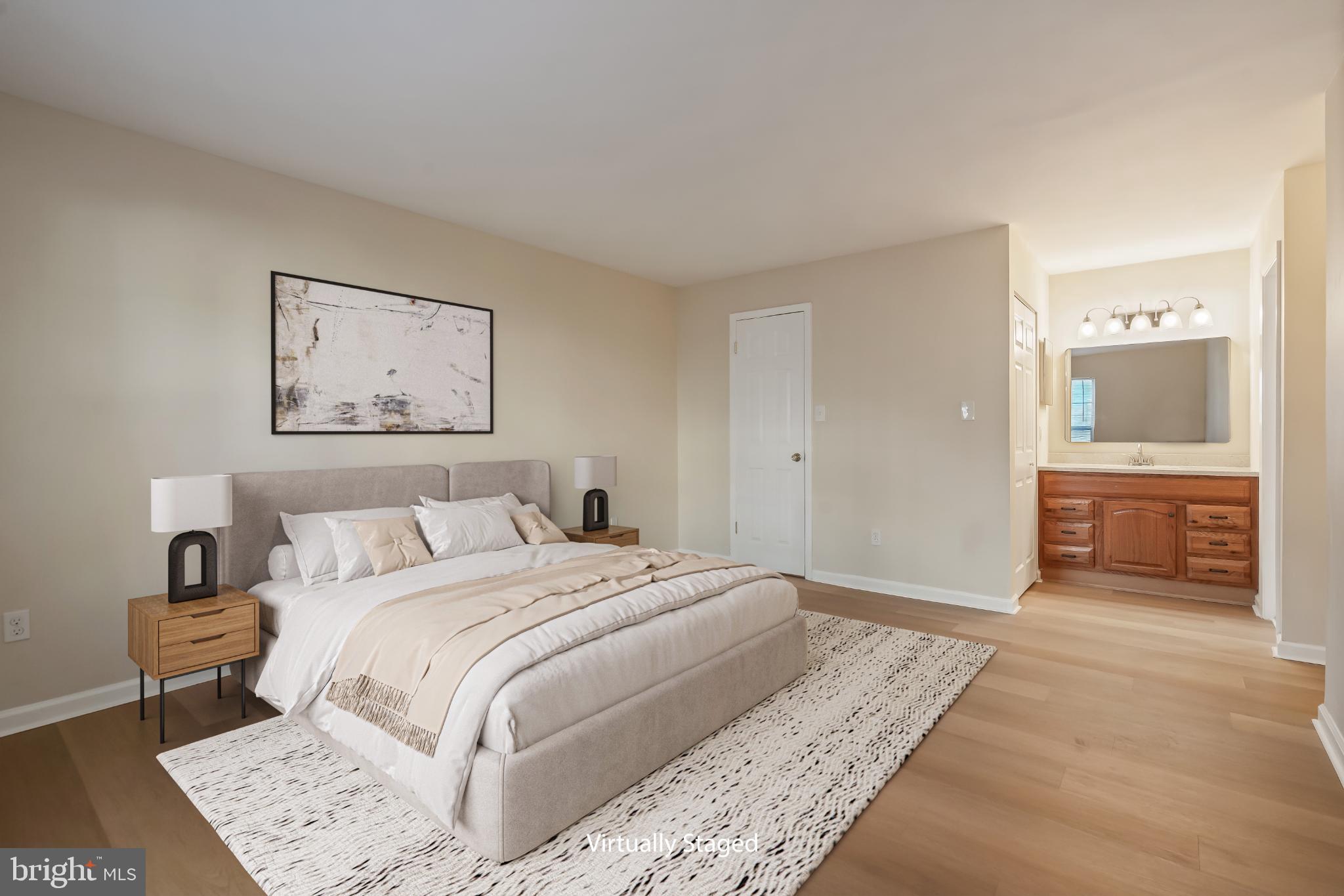 13123 Conductor Way, Unit 243 Silver Spring, MD 20904 - Photo 2 of 17 Serene bedroom with modern elegance.