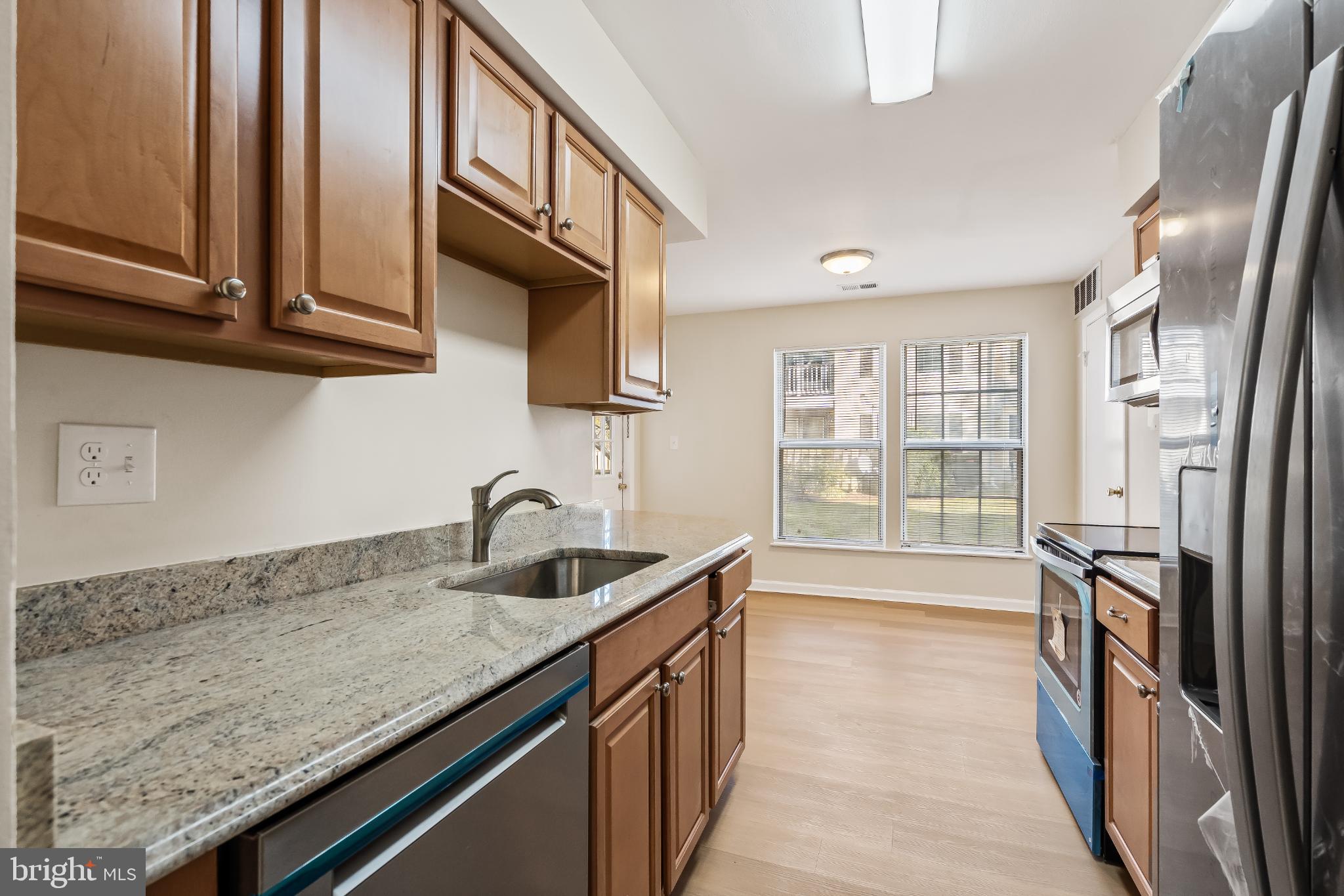 13123 Conductor Way, Unit 243 Silver Spring, MD 20904 - Photo 4 of 17 Bright kitchen with modern finishes.
