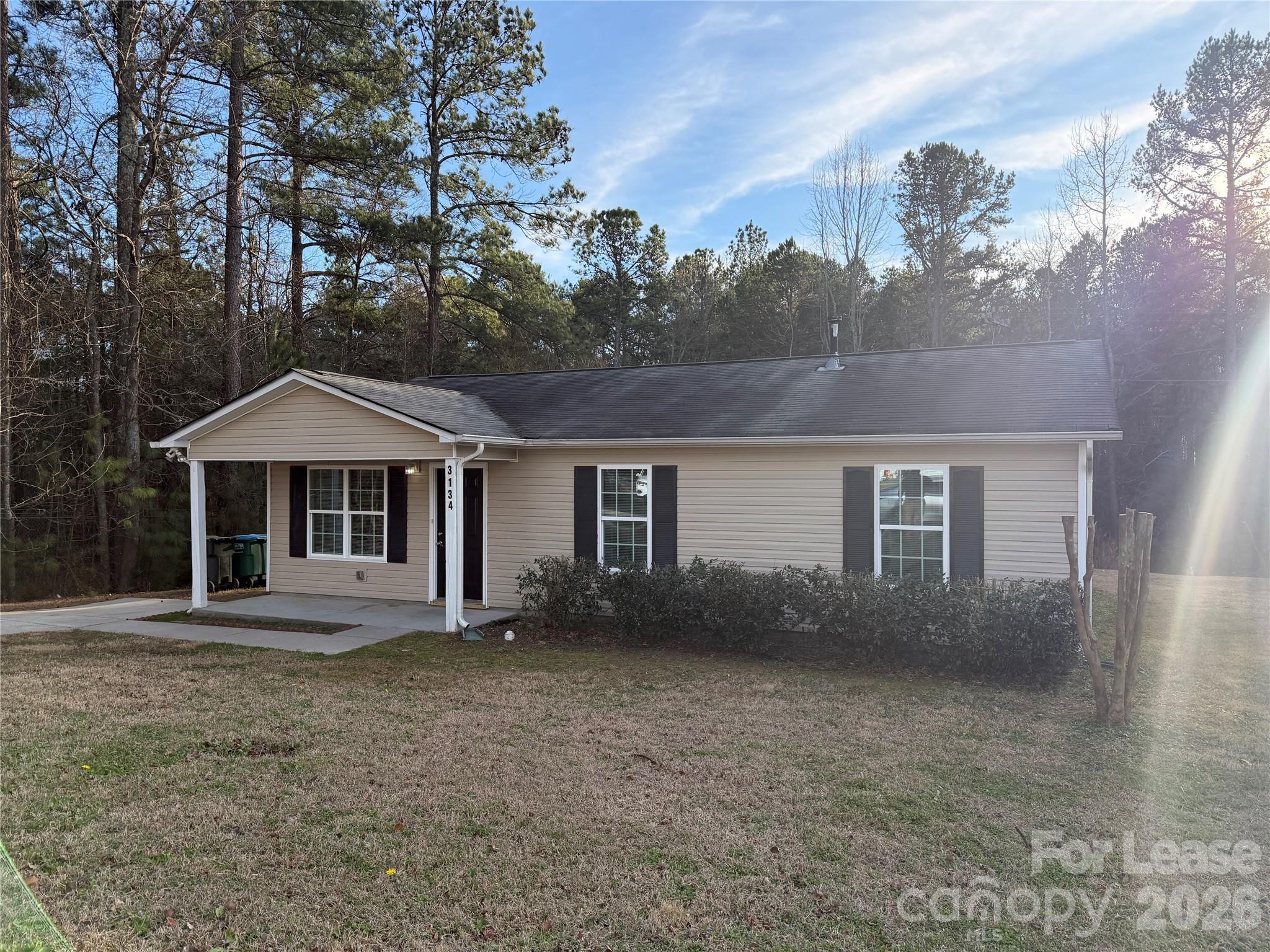 3134 Rainbow Ridge Drive Matthews, NC 28105 - Photo 12 of 12 a front view of a house with yard and trees