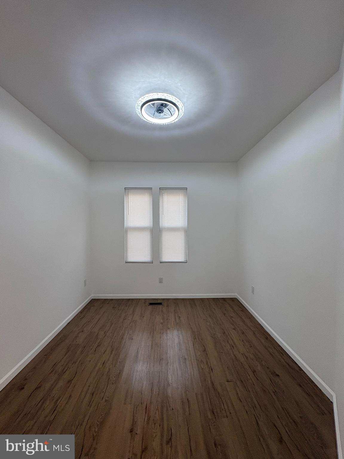 2626 North Jessup Street Philadelphia, PA 19133 - Photo 3 of 12 an empty room with wooden floor and windows