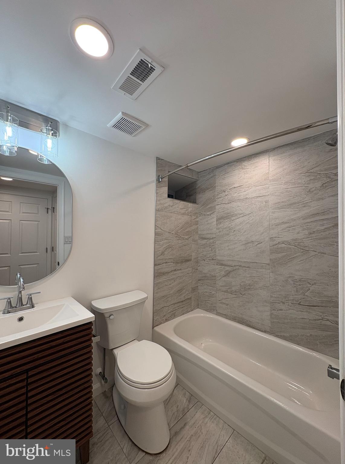 2626 North Jessup Street Philadelphia, PA 19133 - Photo 8 of 12 a bathroom with a sink a toilet and shower