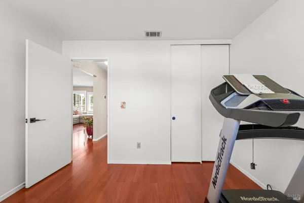 a view of an entryway with wooden floor