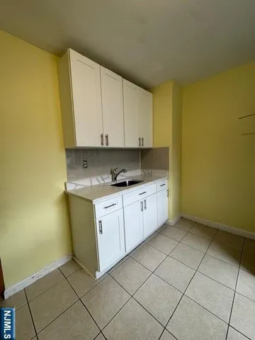 a view of cabinets with wooden floor