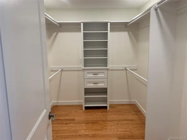 a view of an empty walk in closet