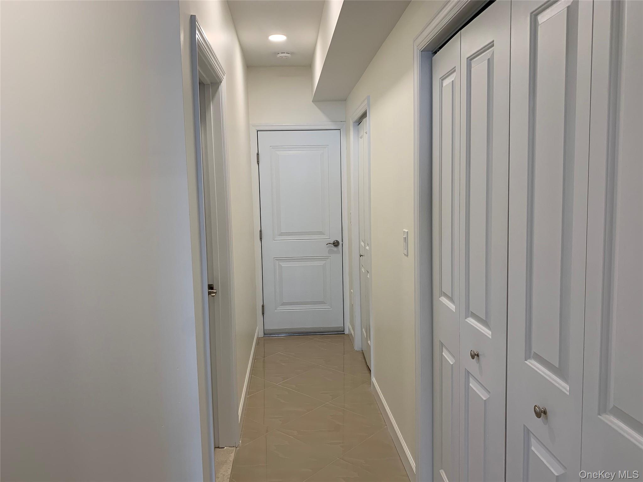 97 Gainsborg Avenue East, Unit RIGHT SIDE West Harrison, NY 10604 - Photo 26 of 39 Hallway in lower level family room. Huge storage closets
