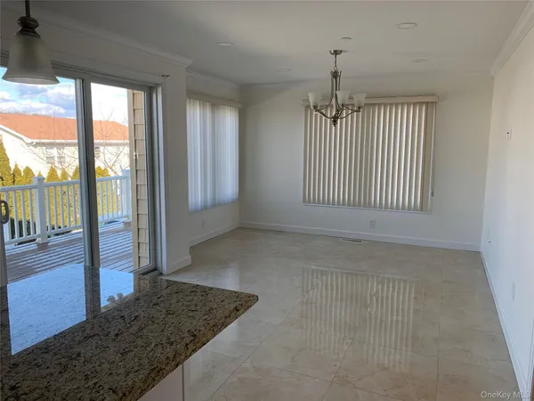 a view of an empty room with glass door