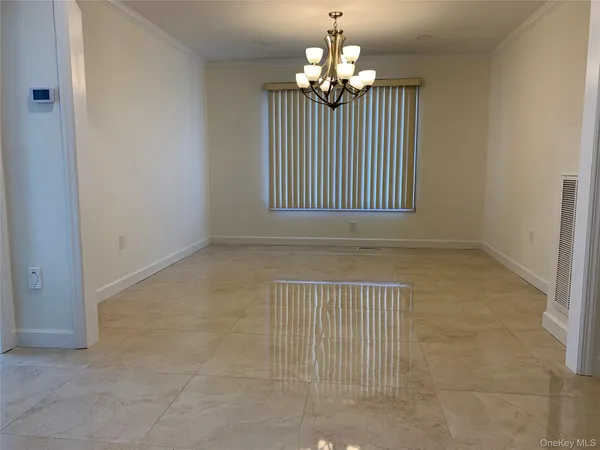 en view of an empty room with a window