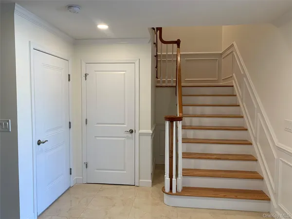 a view of entryway with stairs
