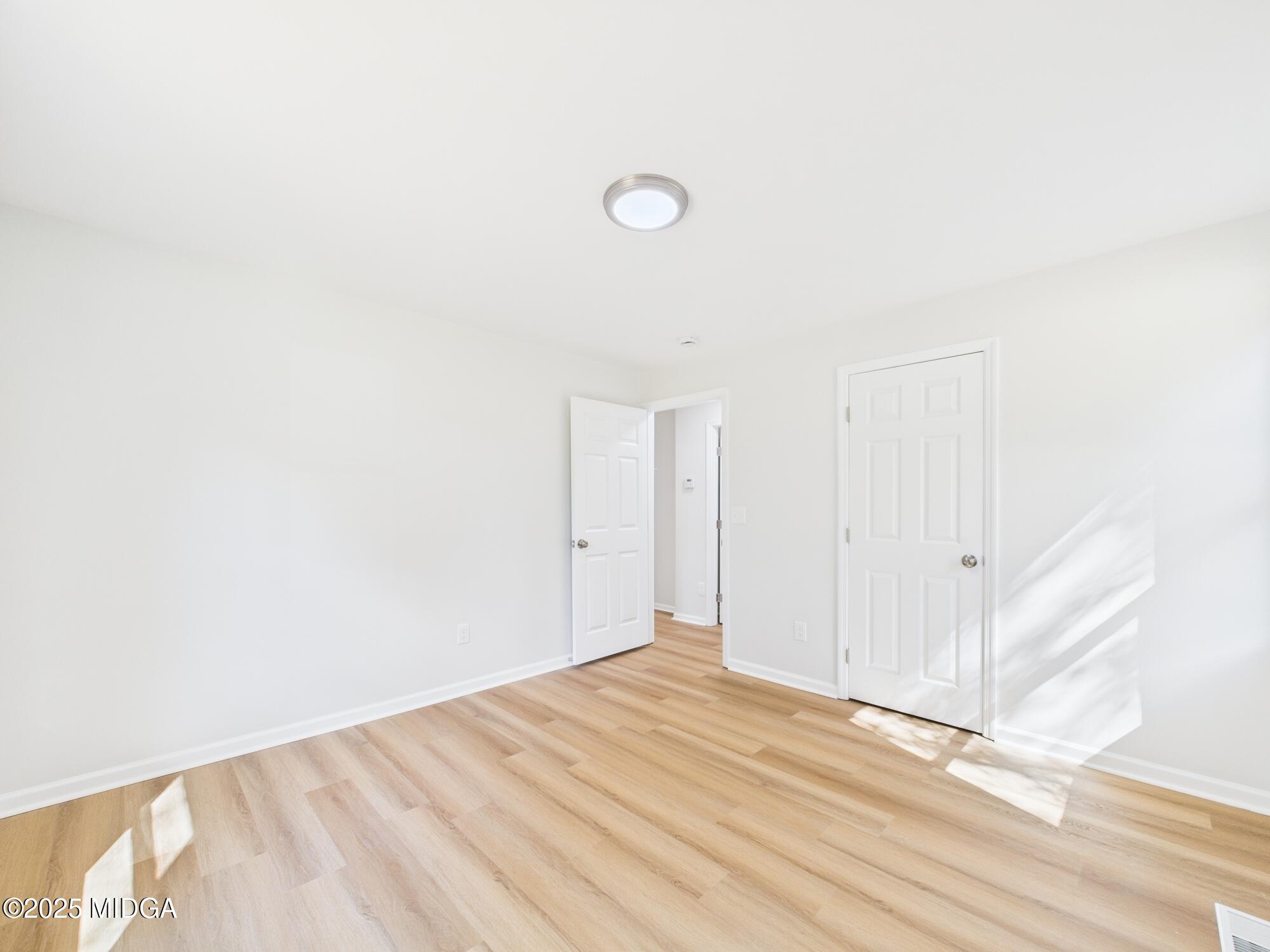 2471 Old Holton Road Macon, GA 31204 - Photo 19 of 34 a view of a room with wooden floor and white walls