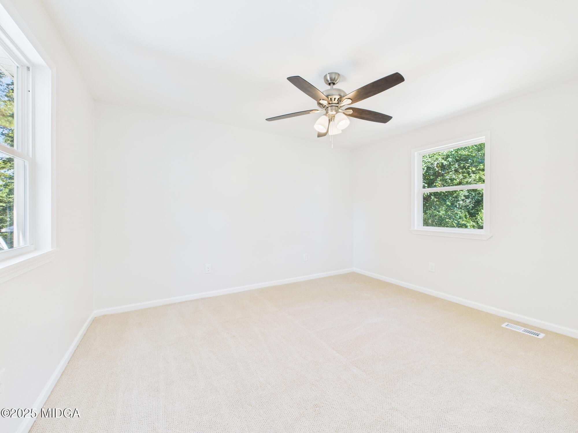 2471 Old Holton Road Macon, GA 31204 - Photo 24 of 34 an empty room with a window and a fan