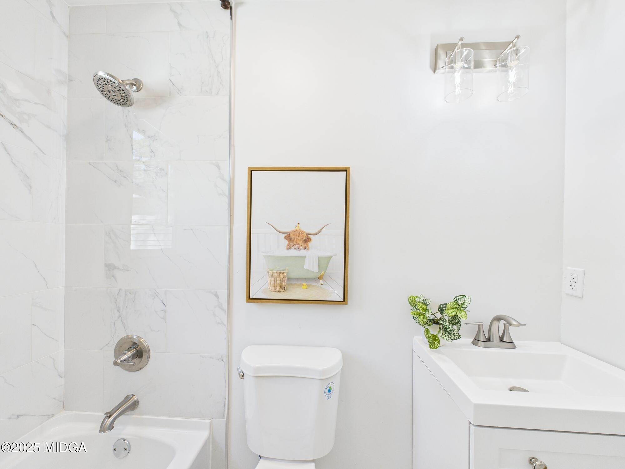 2471 Old Holton Road Macon, GA 31204 - Photo 26 of 34 a bathroom with a sink mirror and toilet
