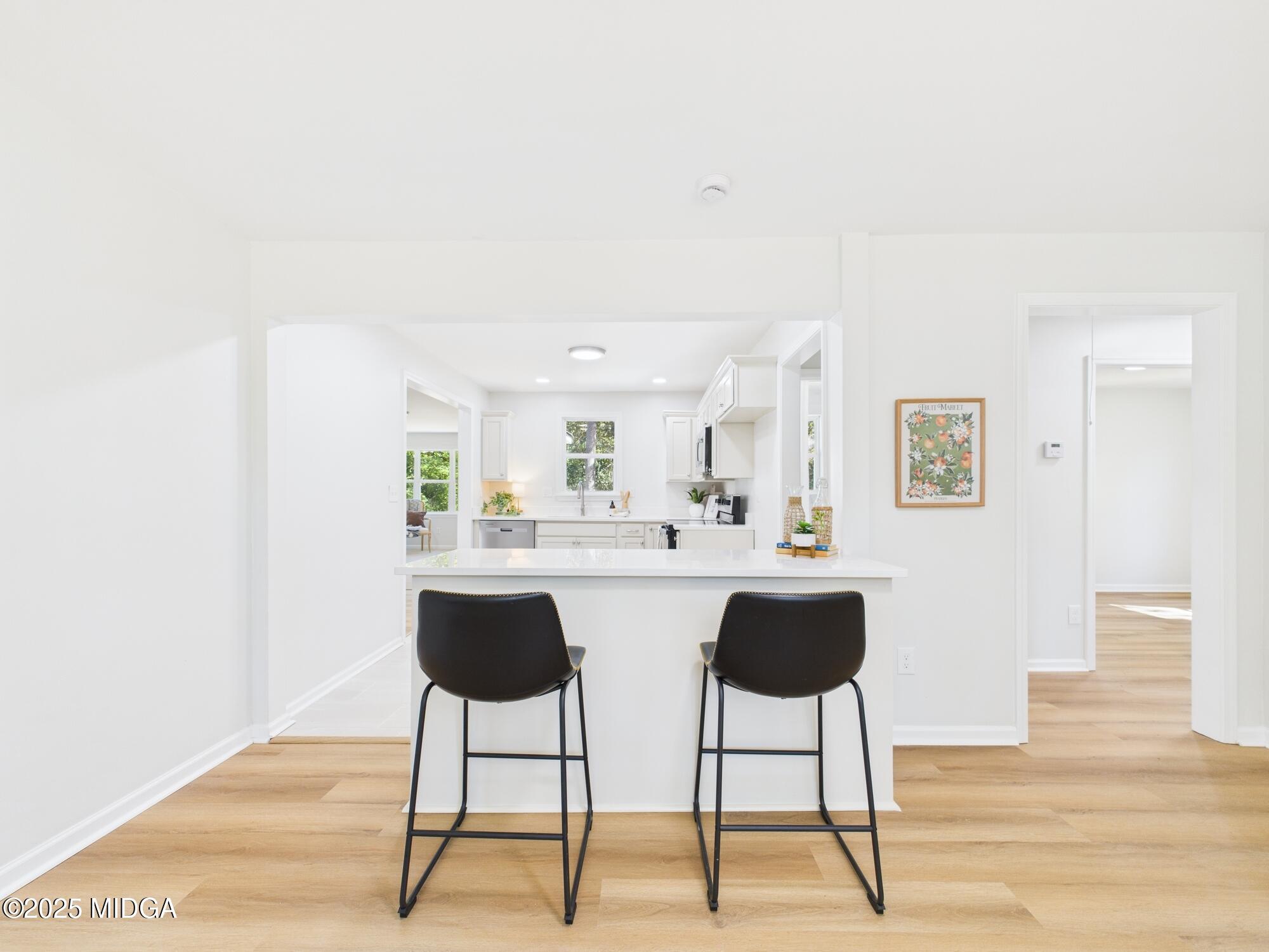 2471 Old Holton Road Macon, GA 31204 - Photo 5 of 34 a view of workspace and kitchen with wooden floor