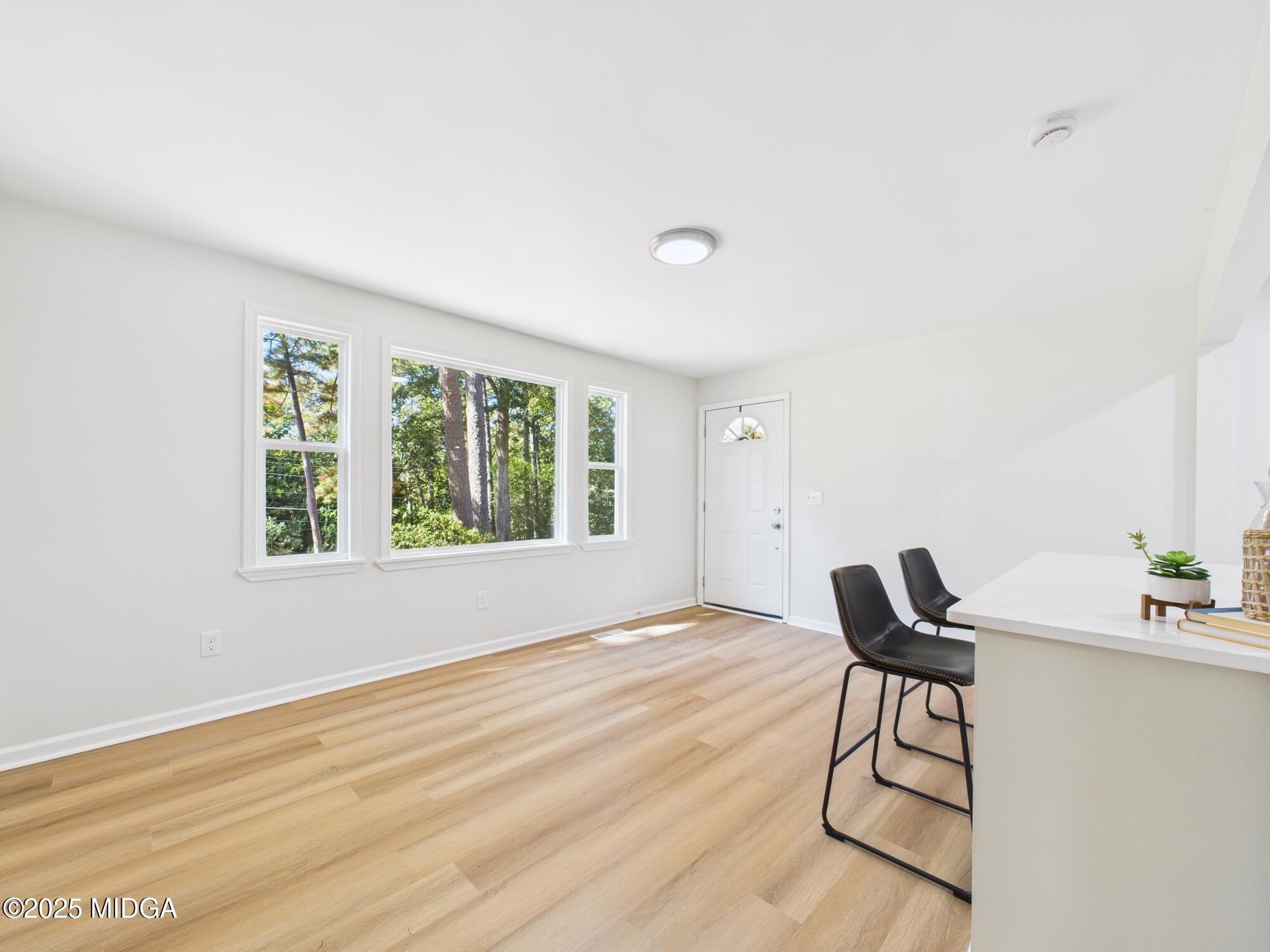 2471 Old Holton Road Macon, GA 31204 - Photo 6 of 34 a view of a livingroom with furniture and wooden floor