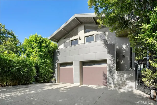 front view of a house with a tree