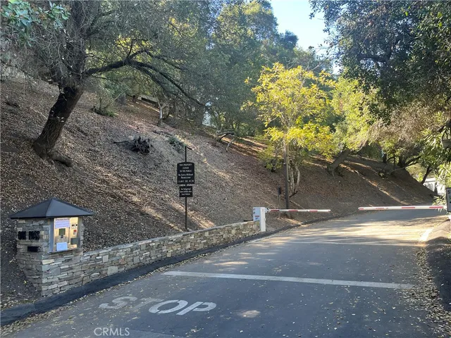 a view of a brick house with a tree