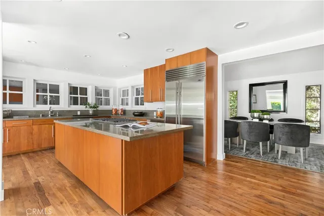 a kitchen with stainless steel appliances granite countertop a stove and a refrigerator