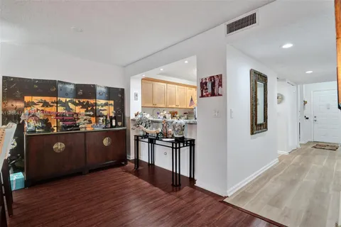 a open kitchen with stainless steel appliances granite countertop a refrigerator and stove