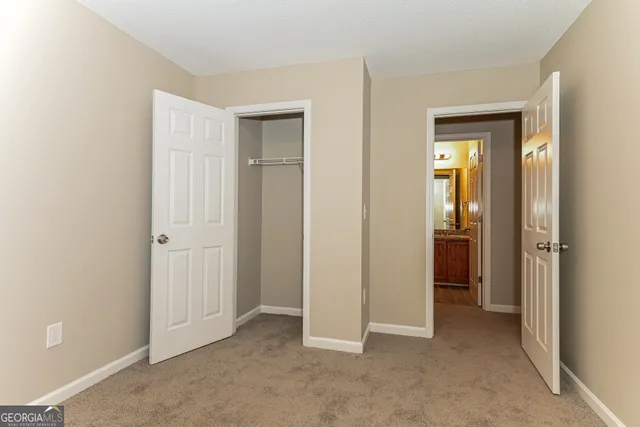 wooden floor and closet area in a room