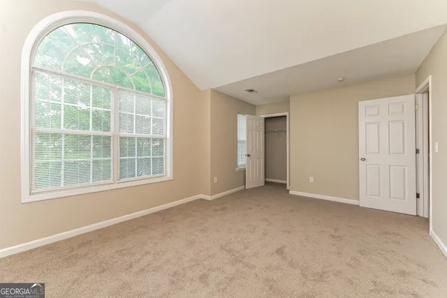 an empty room with a fireplace
