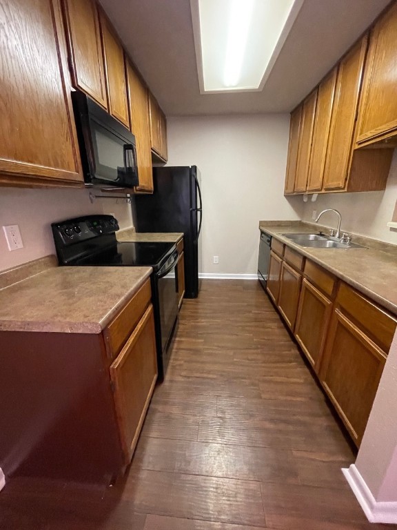 715 West 22 1/2 Street, Unit 201 Austin, TX 78705 - Photo 7 of 15 a kitchen with stainless steel appliances granite countertop a stove a sink and a microwave