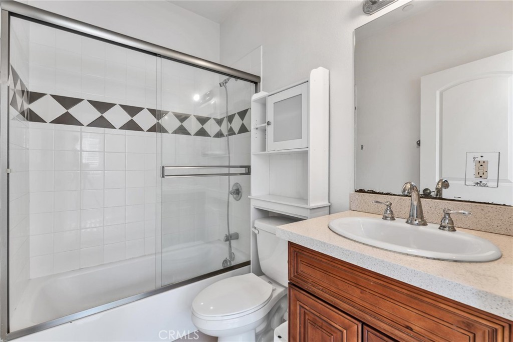 810 North Garfield Avenue Alhambra, CA 91801 - Photo 12 of 26 a bathroom with a sink a toilet and shower
