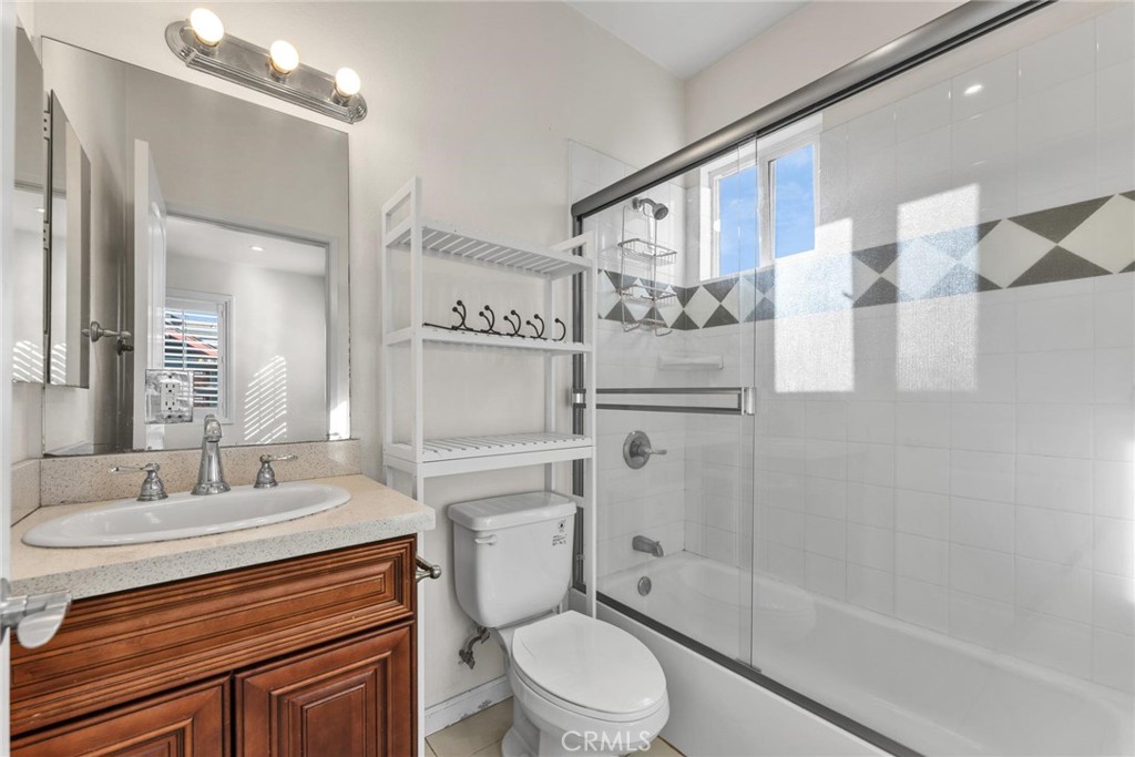 810 North Garfield Avenue Alhambra, CA 91801 - Photo 15 of 26 a bathroom with a sink a toilet and shower