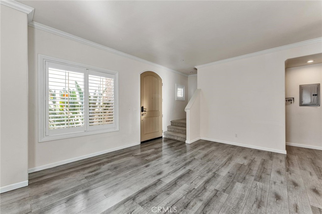 810 North Garfield Avenue Alhambra, CA 91801 - Photo 3 of 26 an empty room with wooden floor and windows