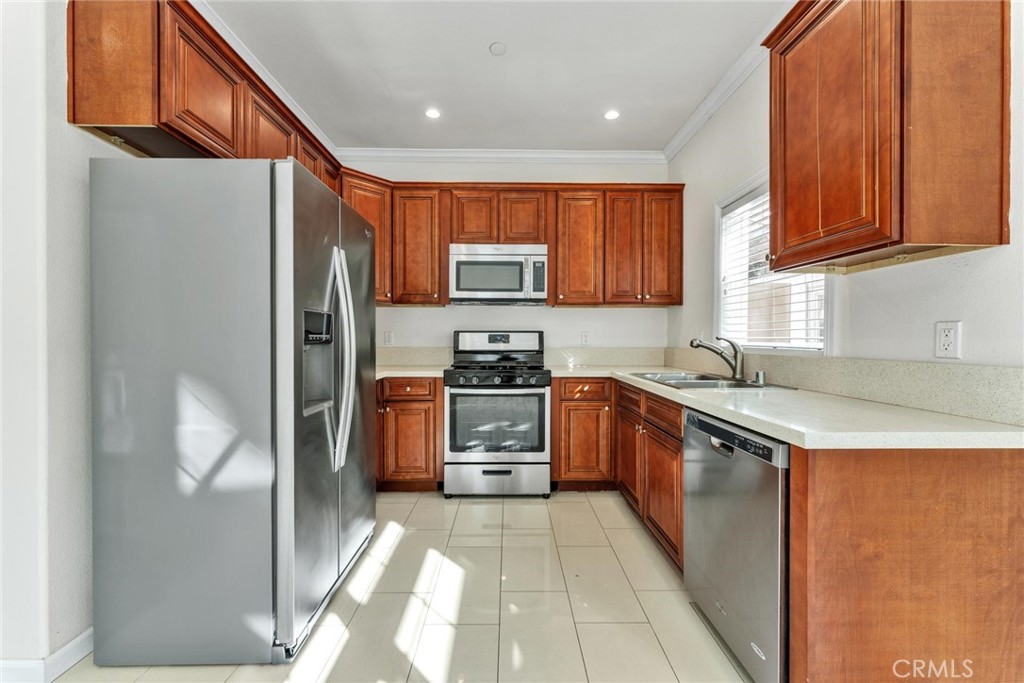 810 North Garfield Avenue Alhambra, CA 91801 - Photo 7 of 26 a kitchen with stainless steel appliances granite countertop a refrigerator stove and sink