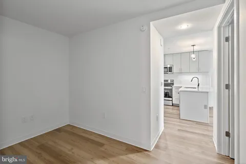 a view of kitchen and wooden floor