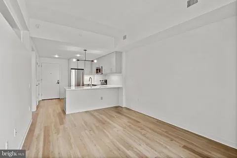 a view of kitchen with wooden floor