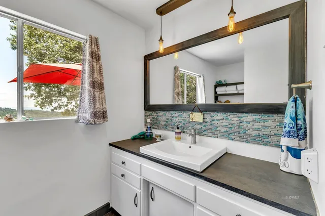 a view of a chairs and table in patio