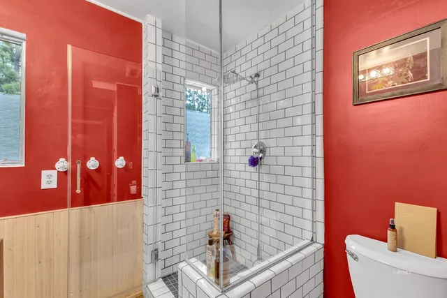 a view of a balcony with furniture and wooden floor