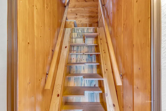 an aerial view of a house with table and chairs