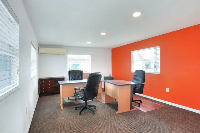 a workspace with furniture and window