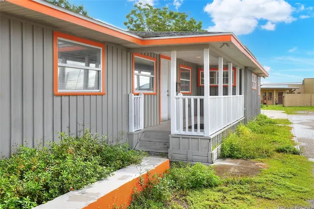 a view of a porch and garden
