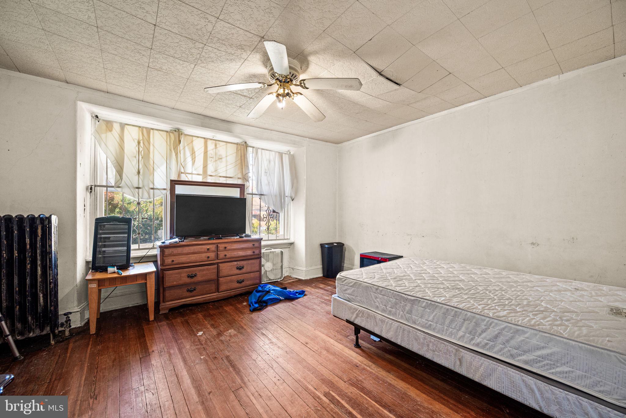 102 West Cliveden Street Philadelphia, PA 19119 - Photo 11 of 25 a bedroom with furniture and a flat screen tv