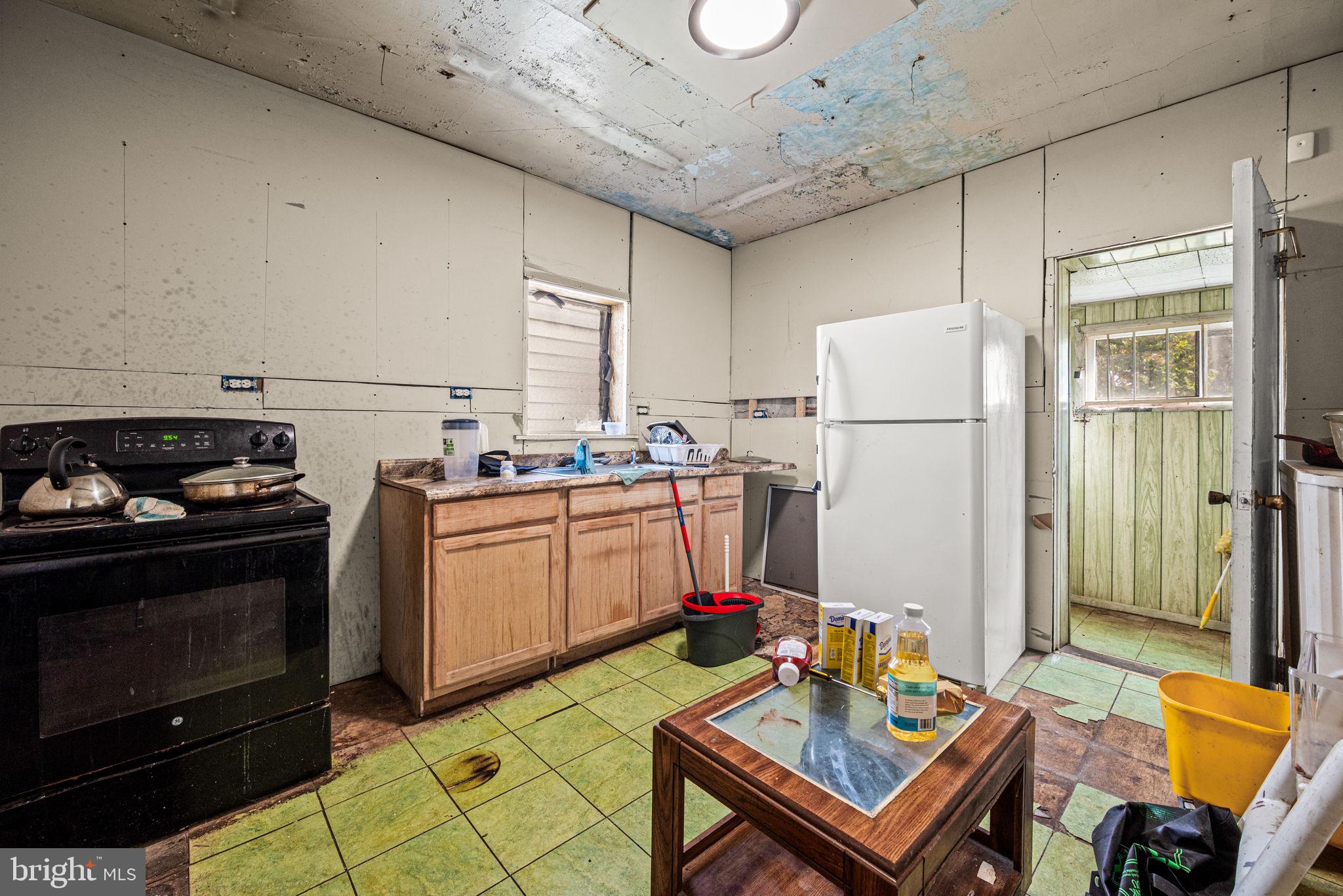 102 West Cliveden Street Philadelphia, PA 19119 - Photo 9 of 25 a kitchen with sink refrigerator and stove