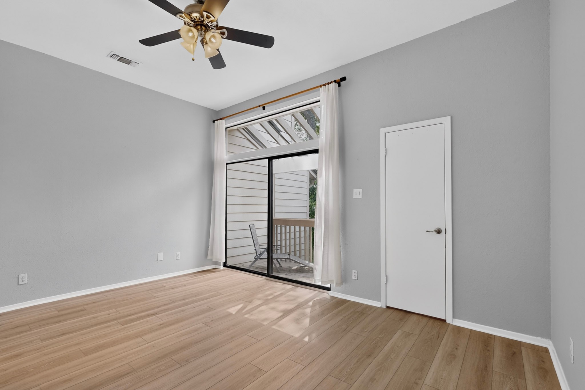 3801 Menchaca Road, Unit 25 Austin, TX 78704 - Photo 13 of 27 Primary bedroom with private balcony and walk in closet