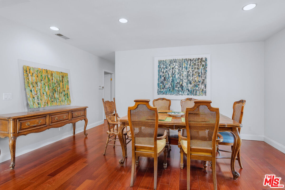 3701 Tilden Avenue Los Angeles, CA 90034 - Photo 11 of 29 a view of a dining room with furniture and wooden floor