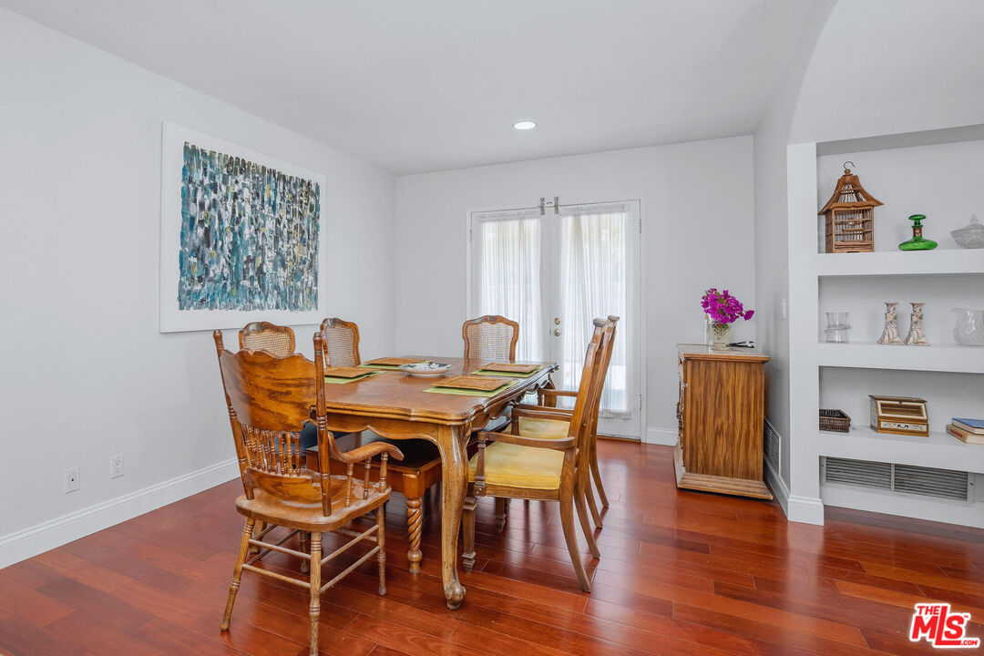 3701 Tilden Avenue Los Angeles, CA 90034 - Photo 12 of 29 a view of a dining room with furniture and wooden floor