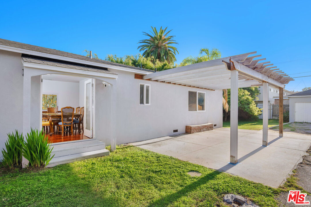 3701 Tilden Avenue Los Angeles, CA 90034 - Photo 14 of 29 a view of a house with backyard and porch