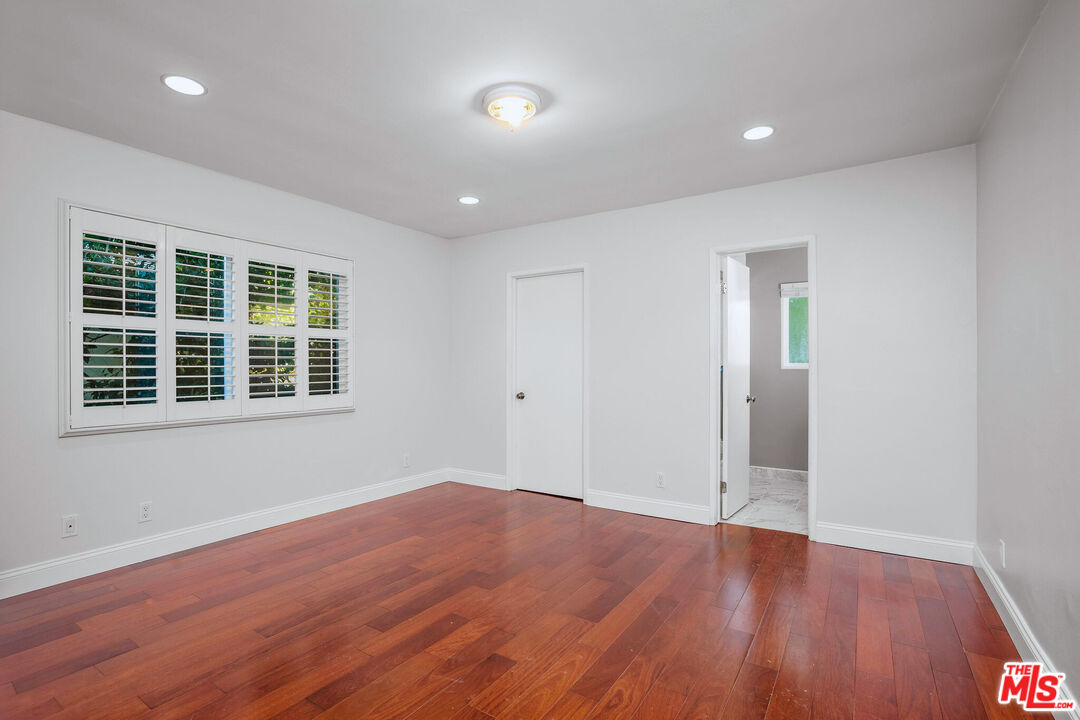 3701 Tilden Avenue Los Angeles, CA 90034 - Photo 21 of 29 a view of empty room with wooden floor and fan