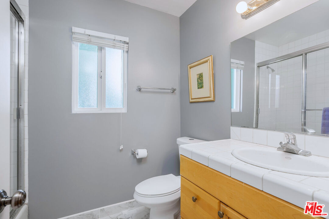 3701 Tilden Avenue Los Angeles, CA 90034 - Photo 23 of 29 a bathroom with a sink toilet and vanity