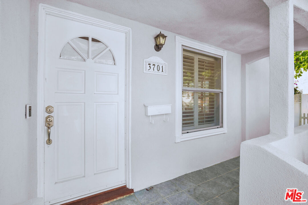 3701 Tilden Avenue Los Angeles, CA 90034 - Photo 24 of 29 a view of an empty room with a window and hardwood floor