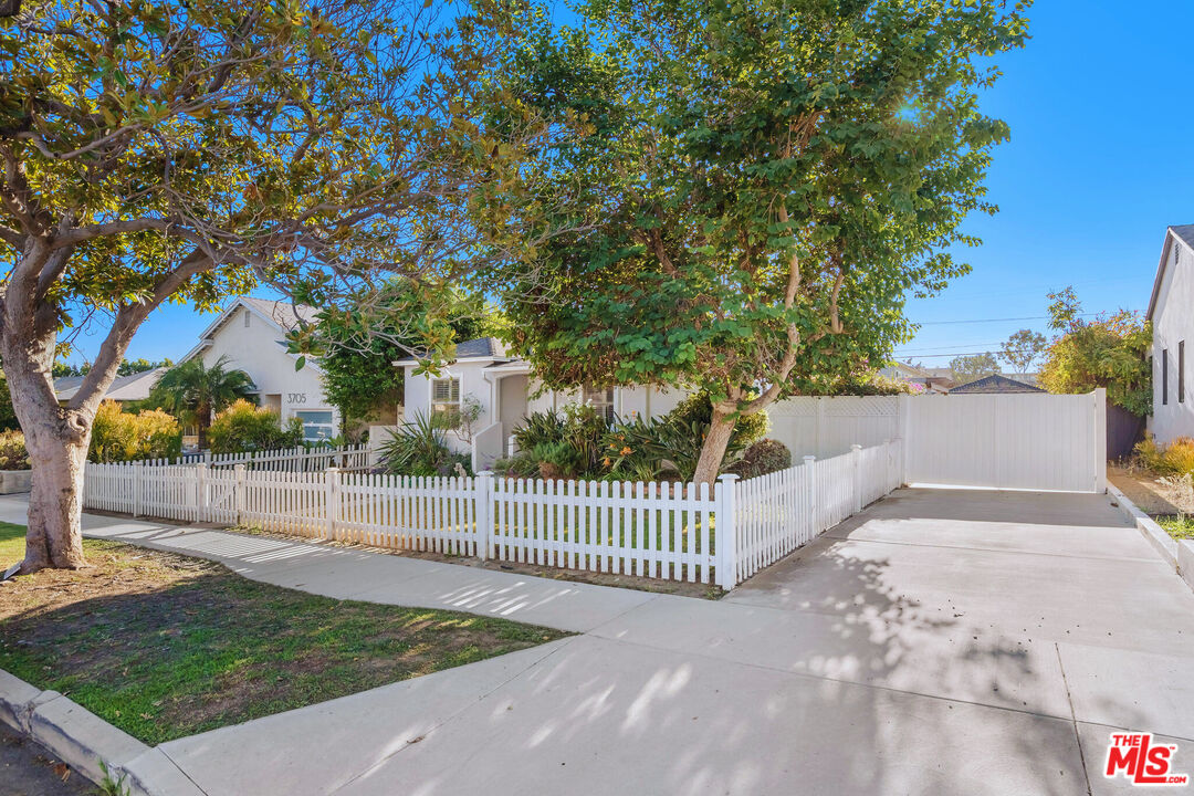 3701 Tilden Avenue Los Angeles, CA 90034 - Photo 3 of 29 a view of a fence yard and a fountain