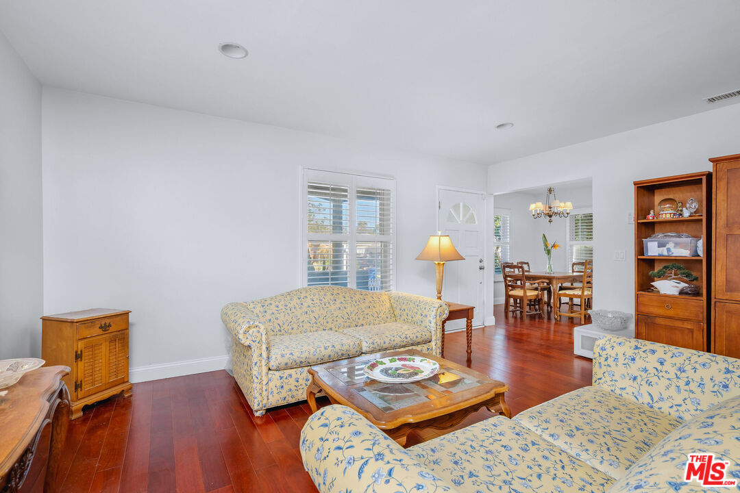 3701 Tilden Avenue Los Angeles, CA 90034 - Photo 6 of 29 a living room with furniture and wooden floor