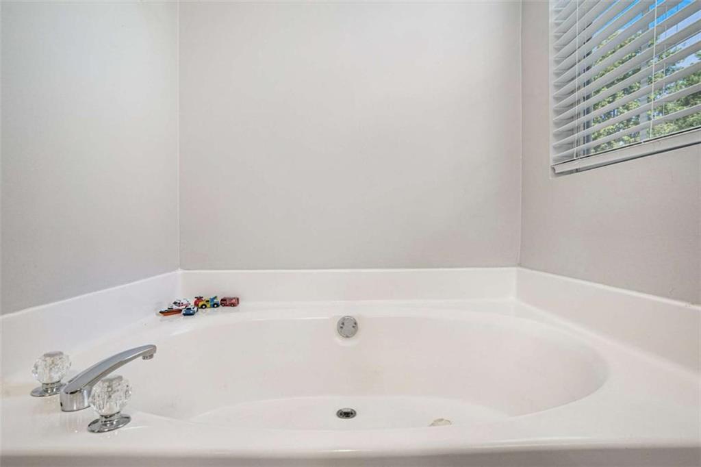 1120 Labonte Parkway McDonough, GA 30253 - Photo 16 of 22 a white bath tub sitting in a bathroom