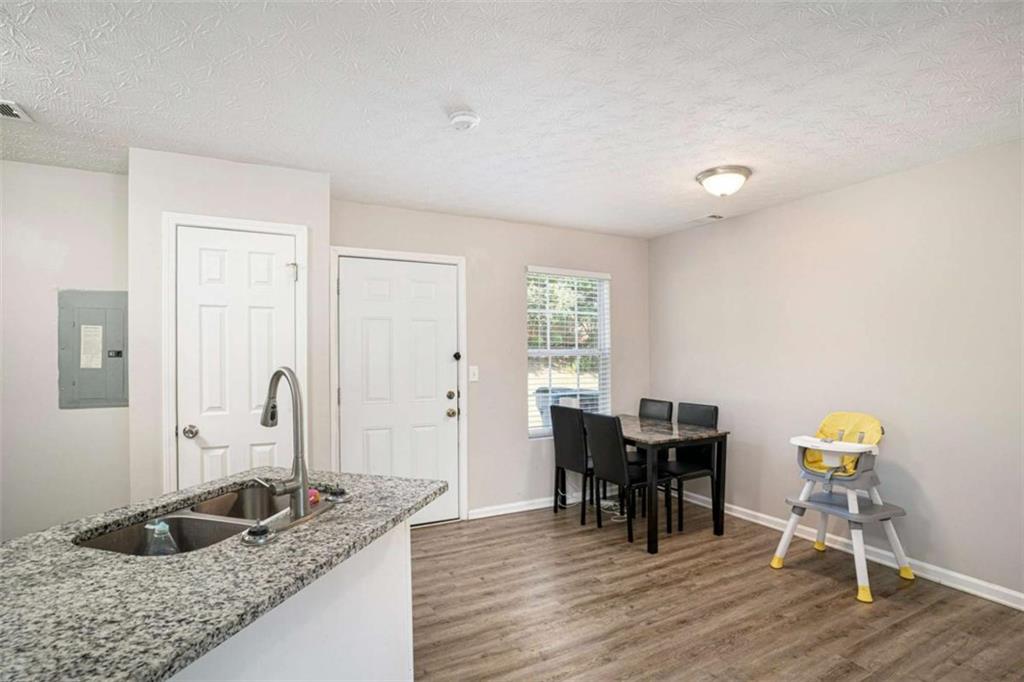 1120 Labonte Parkway McDonough, GA 30253 - Photo 7 of 22 a dining room with furniture and chandelier