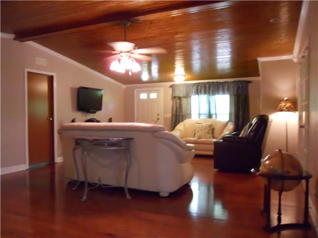 236 East Piney Road Dickson, TN 37055 - Photo 3 of 19 a living room with furniture and a chandelier