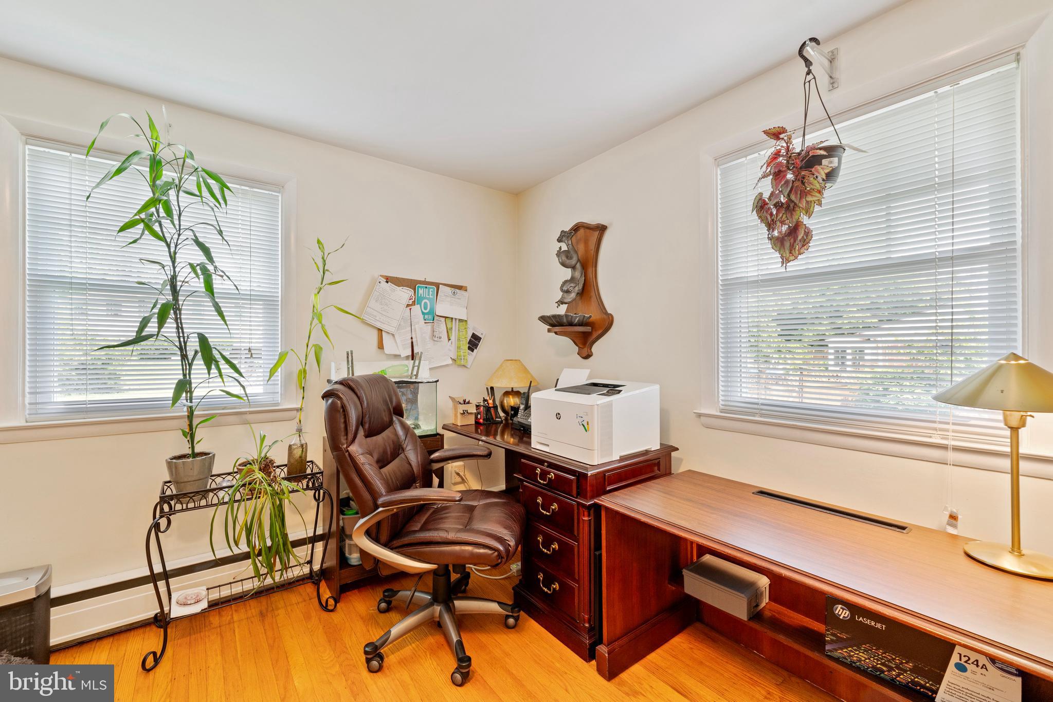 1131 Frederick Road Jenkintown, PA 19046 - Photo 22 of 30 a living room with furniture gym equipment and large windows